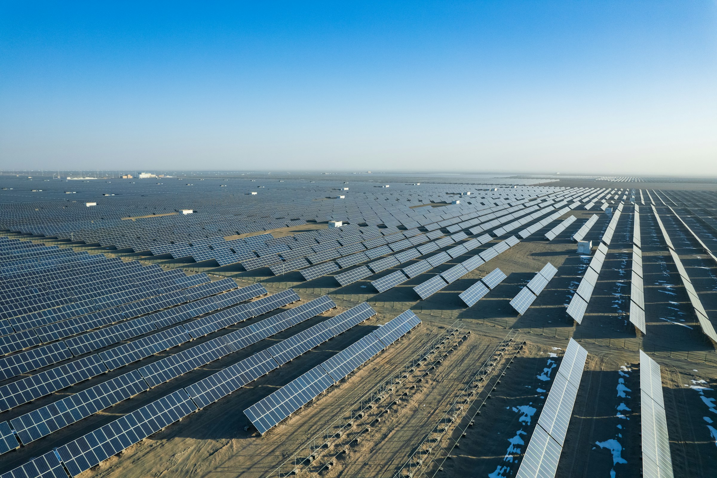 Aerial view of a large-scale solar power plant under construction